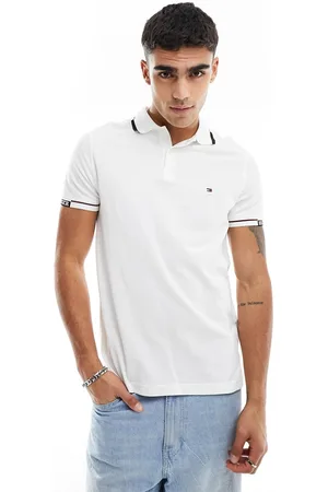 Tommy Hilfiger Polo slim fit bianca con scritta "Hilfiger" sul giromanica