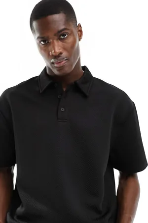 ASOS Polo nera vestibilità comoda testurizzata con motivo a spina di pesce