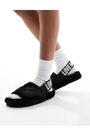 Moschino Pantofole nere con cinturino sul retro
