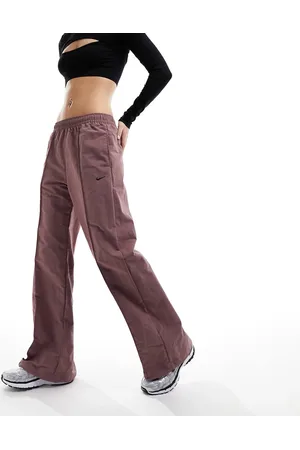 Nike Trend - Pantaloni parachute extra larghi malva fumé