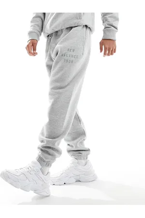 New Balance Iconic - Joggers grigi in pile stile college