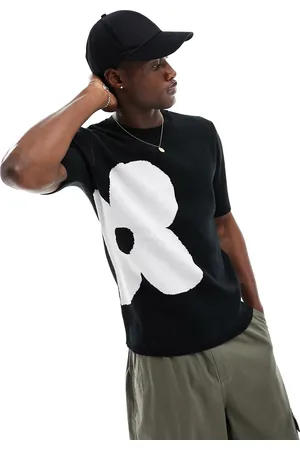 ASOS T-shirt in maglia nera con fiore bianco