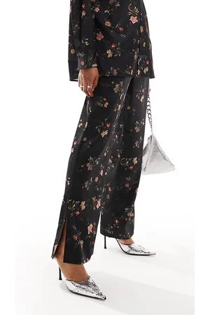 AllSaints Louisa Tanana - Pantaloni neri a fiori