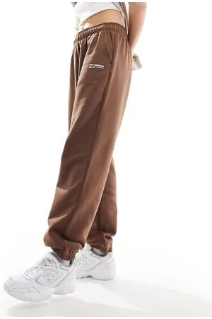 New Balance Heritage - Pantaloni della tuta marroni in pile spazzolato con logo lineare