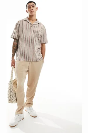 ASOS Polo comoda a righe con rever