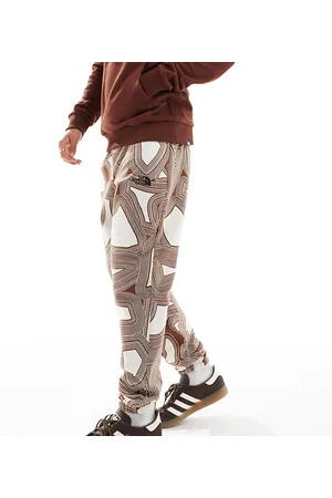 The North Face Essential - Joggers oversize in pile marroni con stampa geometrica - In esclusiva per ASOS