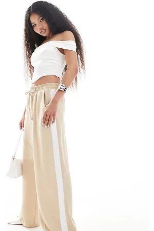 River Island Pantaloni stile joggers con fondo ampio beige a righe