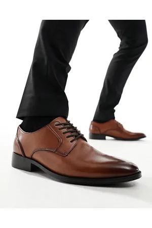 Schuh Reilly - Scarpe Derby in pelle color cuoio
