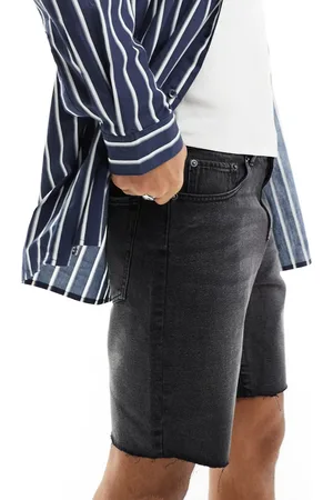 ADPT. Pantaloncini di jeans slavato ampi con orli tagliati a vivo