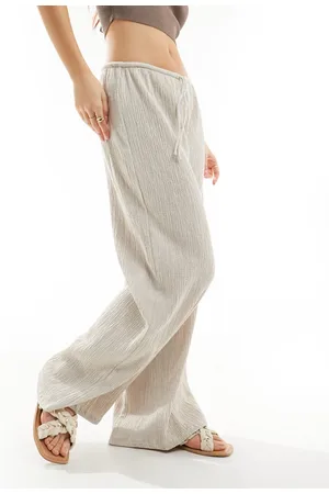 Stradivarius Pantaloni a fondo ampio color pietra stropicciati