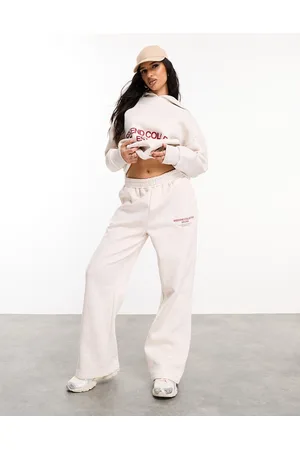 ASOS Joggers oversize color avena con logo rosso