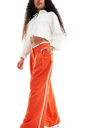 River Island Pantaloni rossi con riga laterale a contrasto