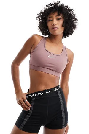 Nike Reggiseno a sostegno medio in tessuto Dri-FIT malva fumo con logo Nike
