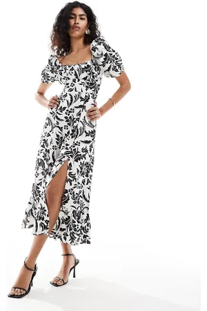 & OTHER STORIES Vestito in lino nero e bianco con stampa botanica, maniche a sbuffo, gonna al polpaccio e spacco