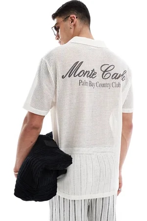 ASOS Polo comoda sporco con stampa sul retro
