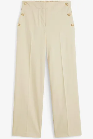 bonprix Pantaloni larghi con bottoni decorativi