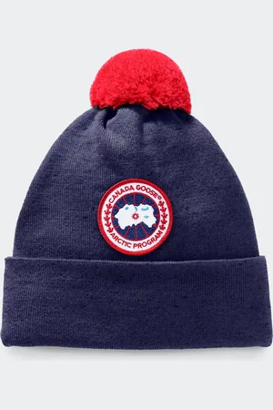 Canada Goose Toque con pon pon in lana merino da bambino
