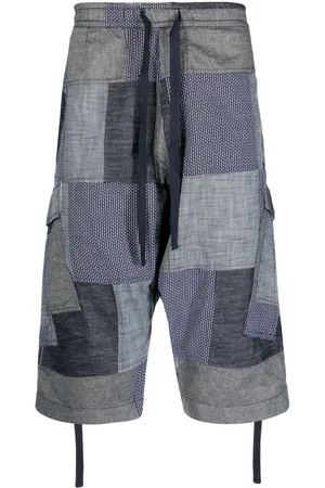 Maharishi Shorts crop con design patchwork