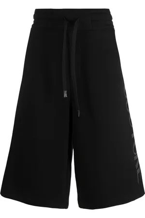 VERSACE Shorts sportivi con stampa