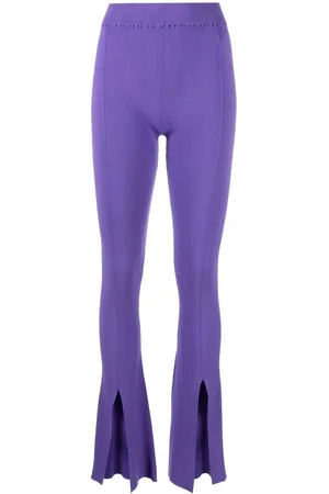 REMAIN Pantaloni con spacco frontale