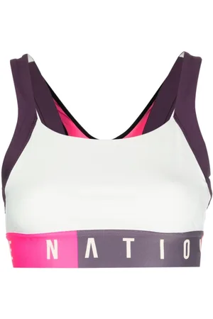 P.E Nation Reggiseno sportivo Motion con banda logo