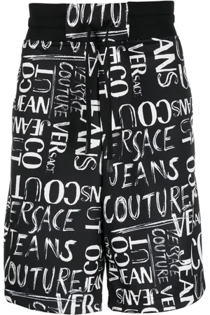 VERSACE Shorts sportivi con stampa
