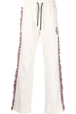 MARCELO BURLON Pantaloni sportivi con frange