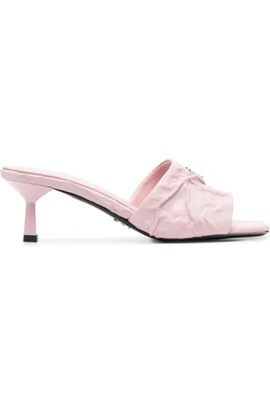 Prada Mules con placca logo
