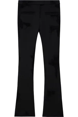 Courrèges Pantaloni svasati con effetto vissuto