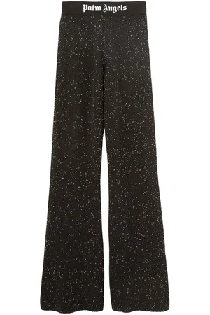 Palm Angels Pantaloni svasati con stampa