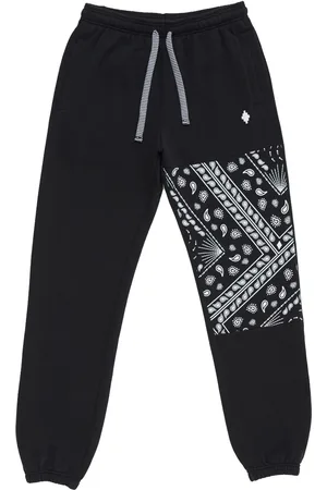 MARCELO BURLON Pantaloni sportivi con stampa bandana