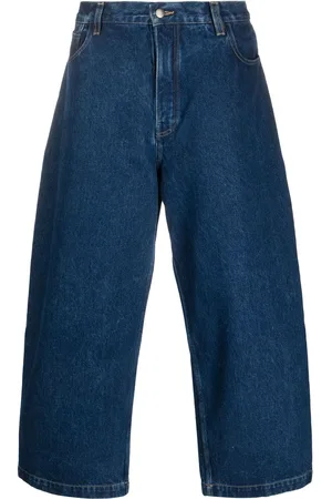 STUDIO NICHOLSON Jeans crop a gamba ampia