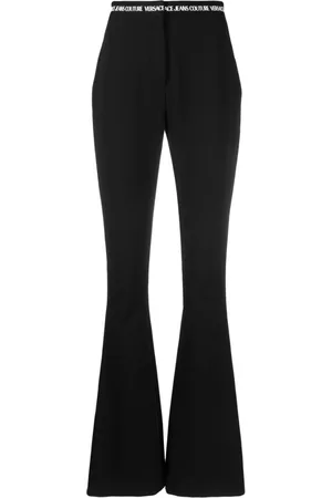 VERSACE Pantaloni svasati con banda logo
