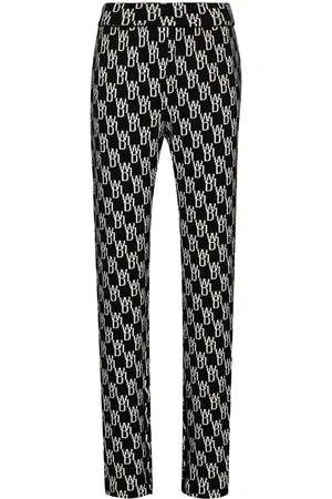 We11 Done Pantaloni con monogramma