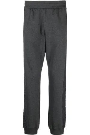 VERSACE Pantaloni sportivi affusolati con motivo Barocco