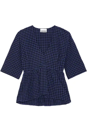 Ganni Blusa con peplum