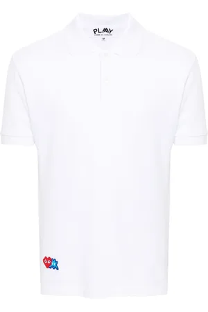 Comme des Garçons Polo con applicazione x The Artist Invader