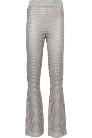 REMAIN Pantaloni svasati a righe