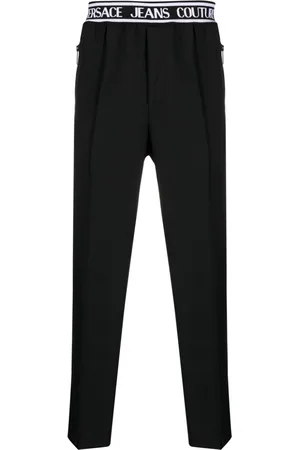VERSACE Pantaloni slim con banda logo
