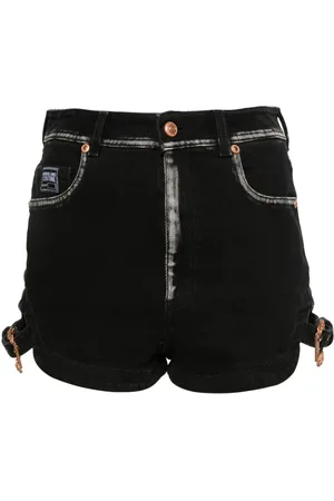 VERSACE Shorts denim con logo goffrato
