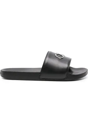 Calvin Klein Sandali slides a punta aperta con placca logo
