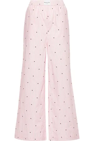 ROTATE Pantaloni dritti con stampa