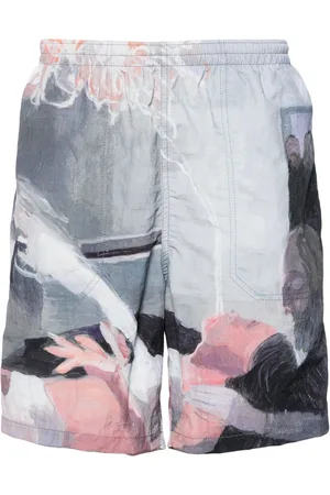 UNDERCOVER Shorts sportivi con stampa