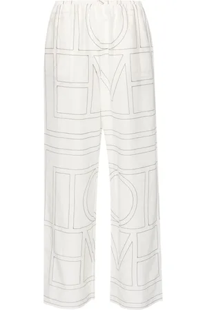 Totême Pantaloni con ricamo monogramma
