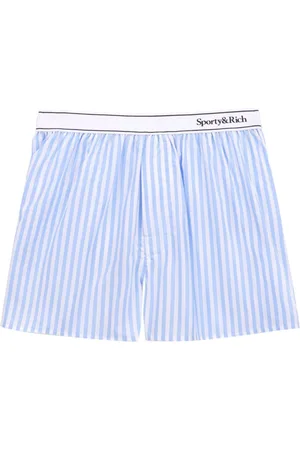 Sporty & Rich Shorts con banda logo
