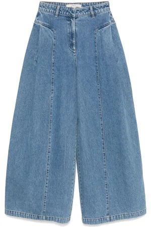 REMAIN Jeans a gamba ampia