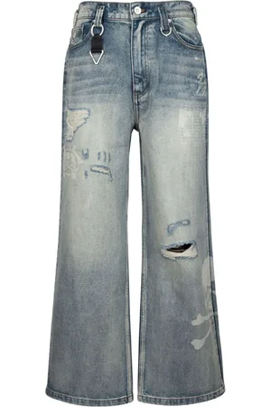 MASTERMIND JAPAN Jeans a gamba ampia con stampa x C2H4