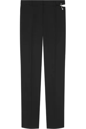 VERSACE Pantaloni con spilla da balia