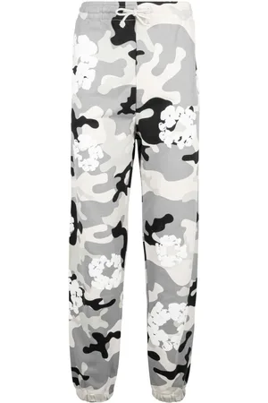 DENIM TEARS Pantaloni con stampa camouflage