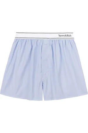 Sporty & Rich Shorts con banda logo